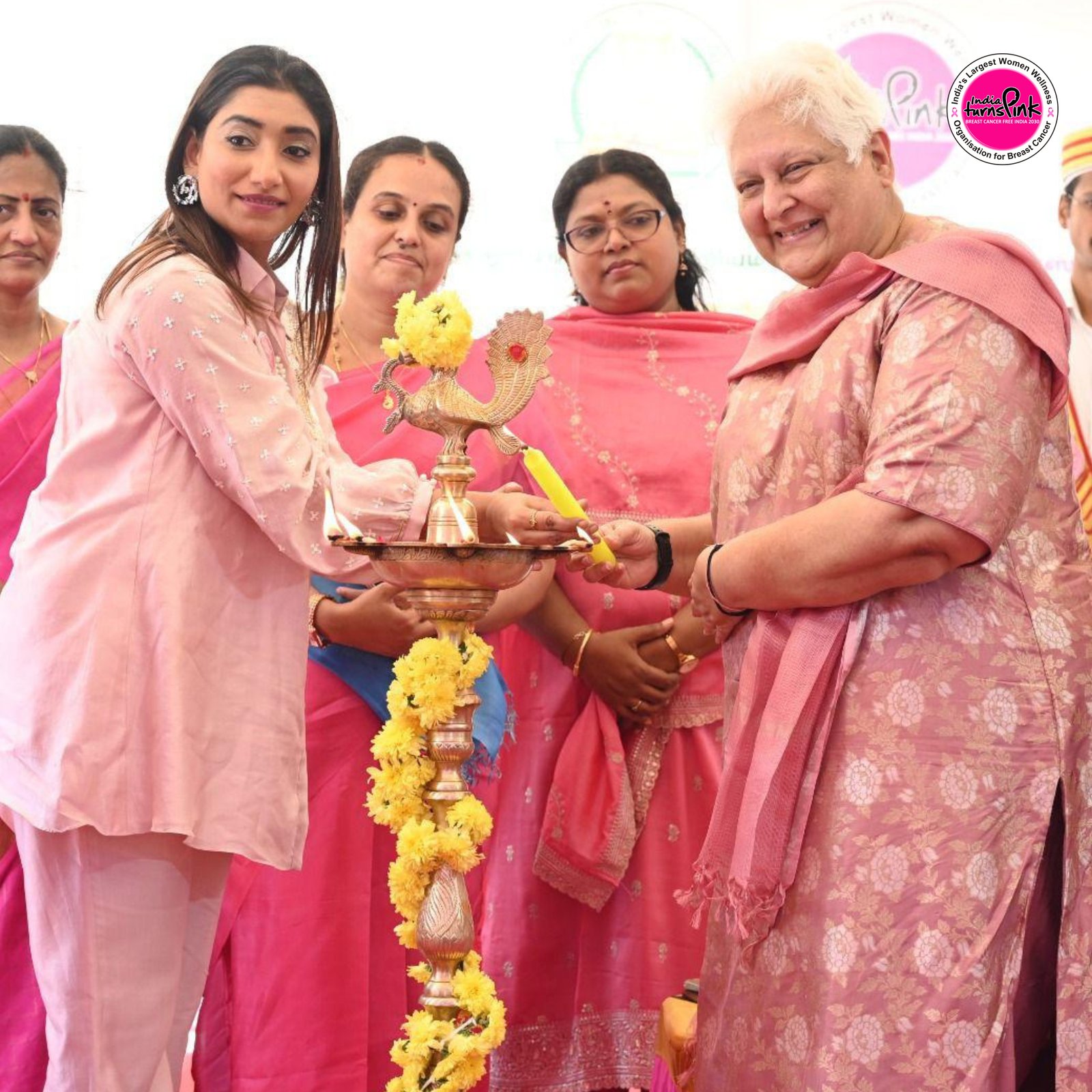 A community awareness gathering held in pink