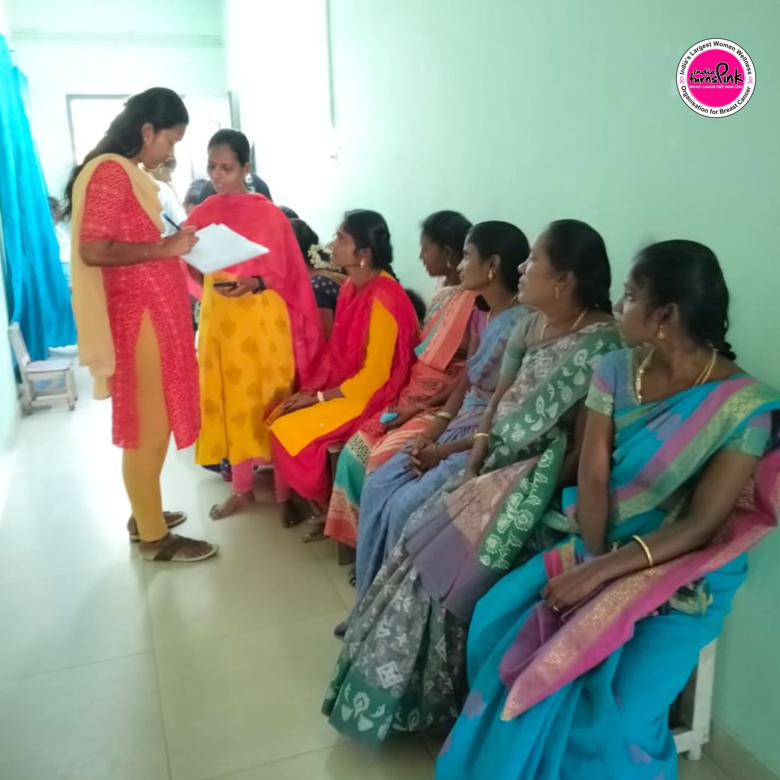 A group gathered in pink at an India Turns Pink awareness activity