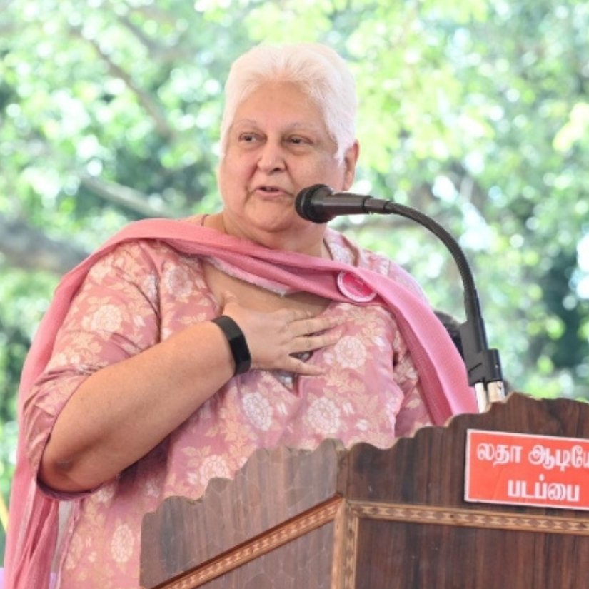A speaker addressing an audience from a podium at a breast cancer awareness programme